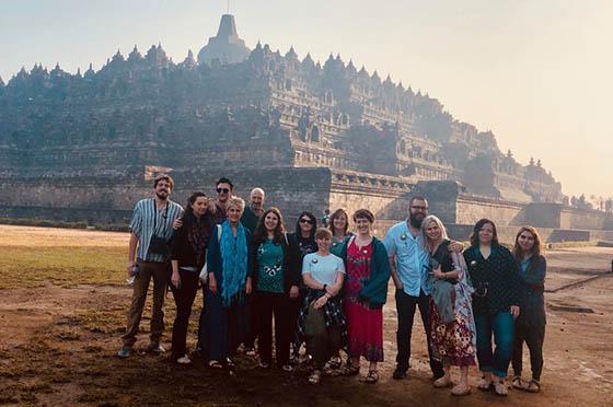 Photo of a group of 波胆网站 students posing in front of a building in Indonesia